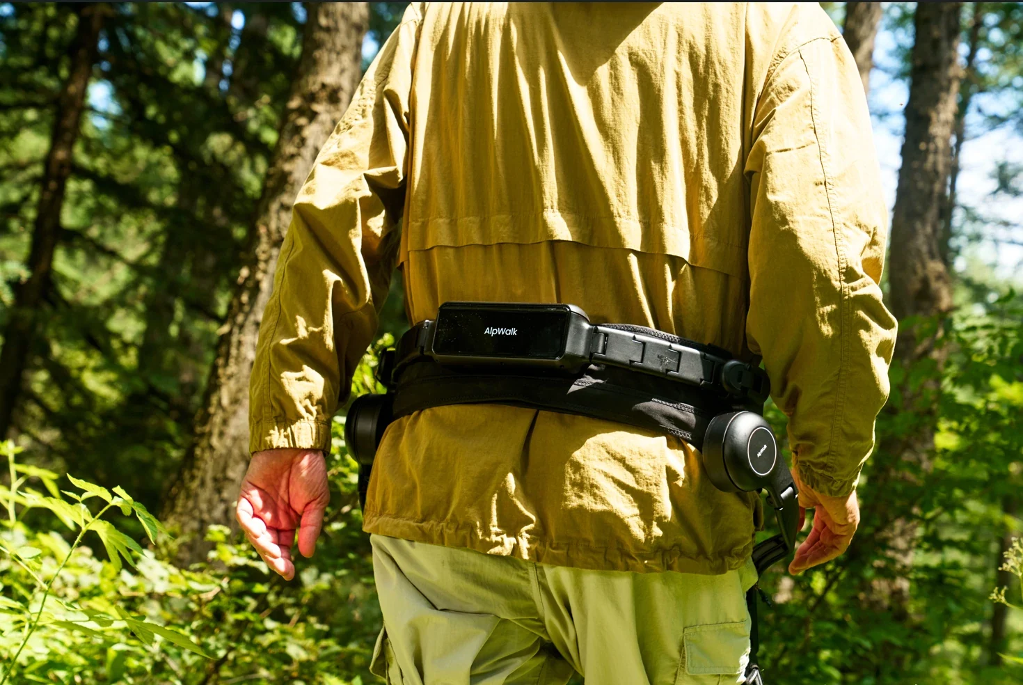 AlpWalk S1 worn at the hips on a woodland walk