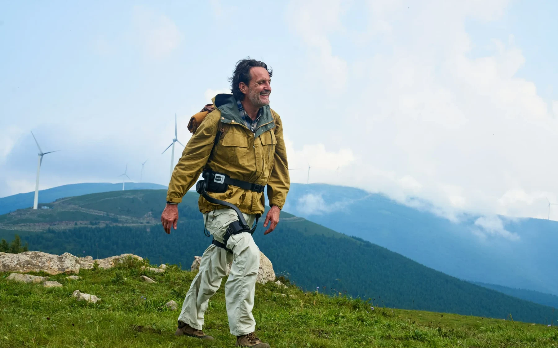 Hiker wearing AlpWalk S1 in the mountains