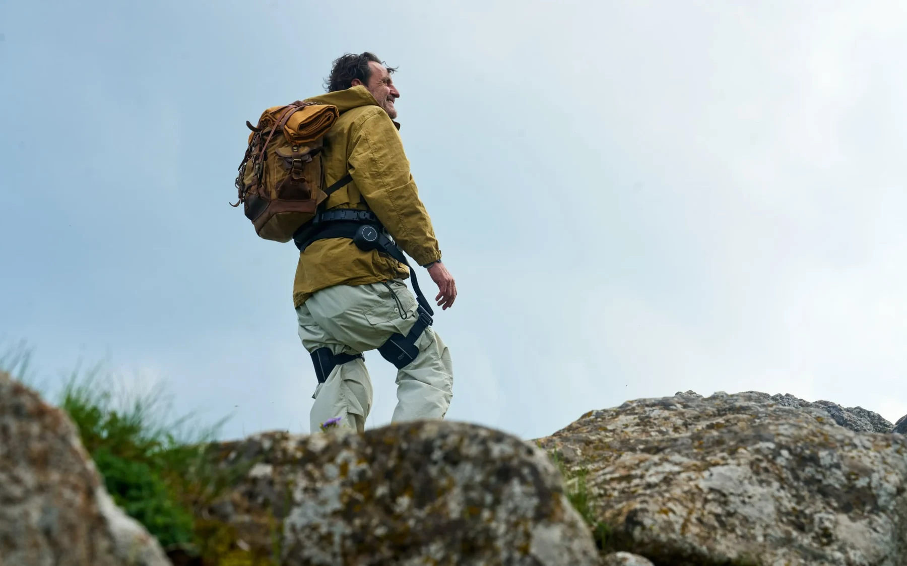 Traveler wearing AlpWalk S1 at a scenic overlook